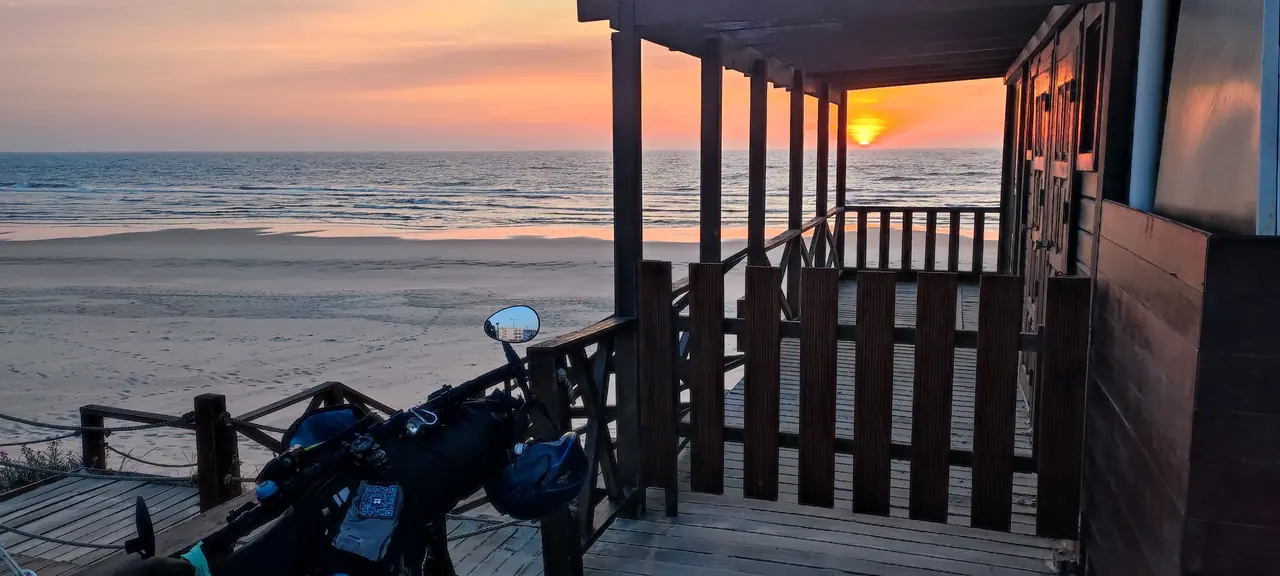 Touring bicycles overlooking the rocky Adriatic coast at sunset