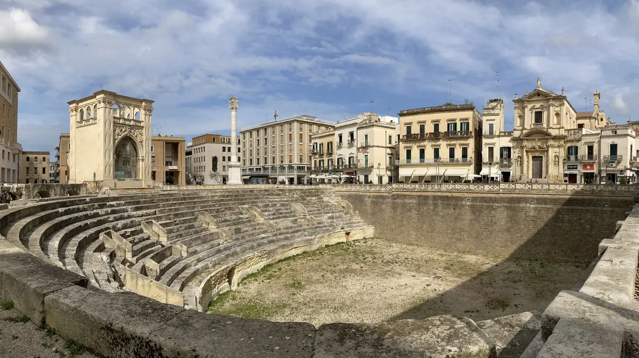 Piazza Sant'Oronzo in Lecce with the excavated Roman amphitheatre in the middle of the square and the column of Sant'Oronzo